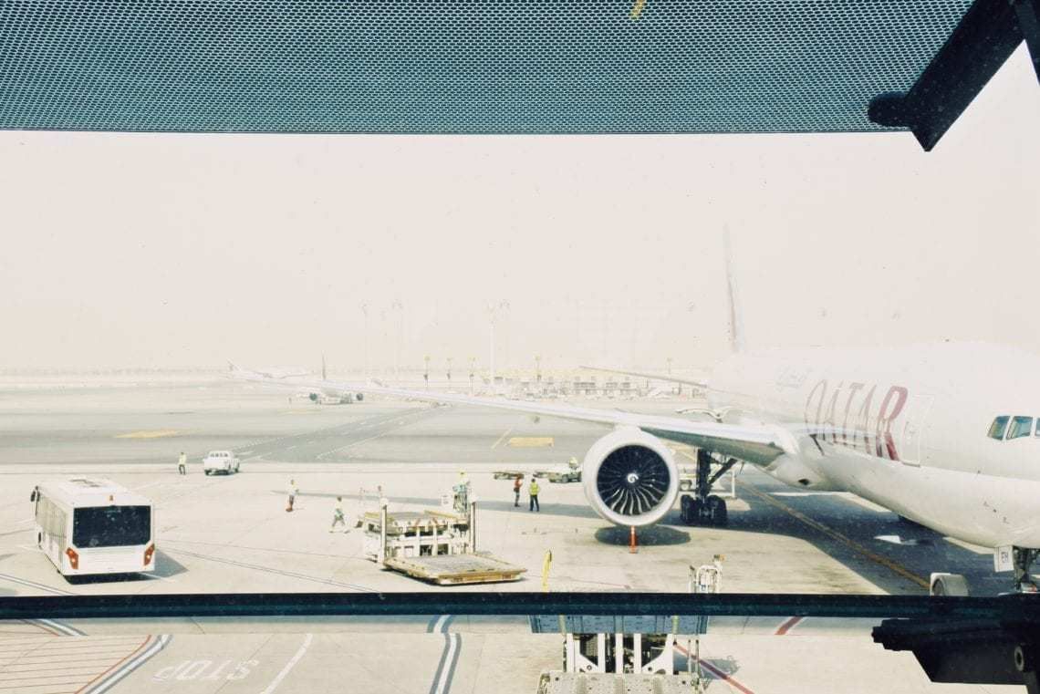 Qatar Airways aircraft parked at gate
