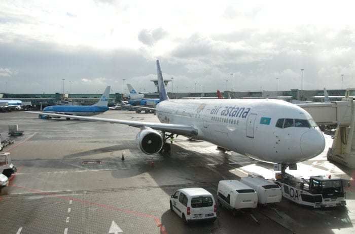Air Astana A320 at airport gate 