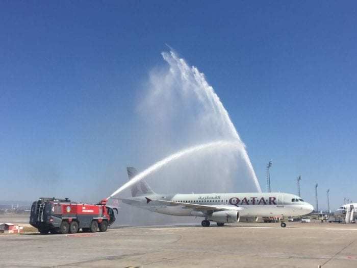 a Qatar Airways A320 getting a water salute
