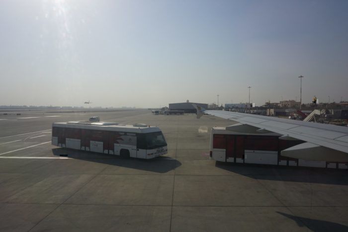 Buses waiting next to the plane