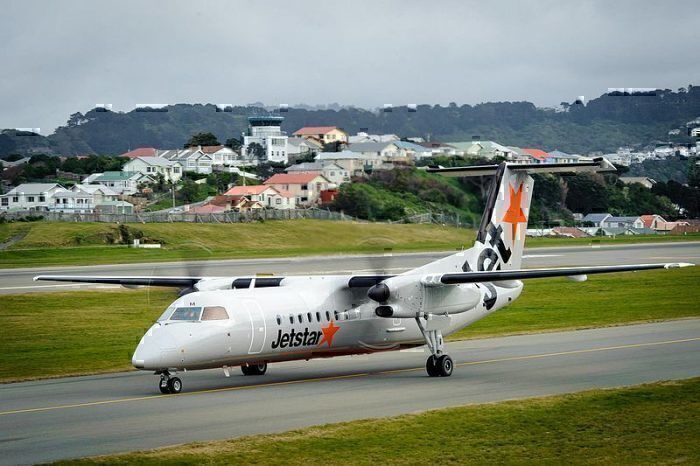 A Jetstar New Zealand Dash 8 taxiing to the gate.