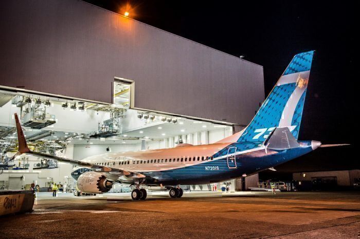 A Boeing 737MAX in house livery leaving a hanger.