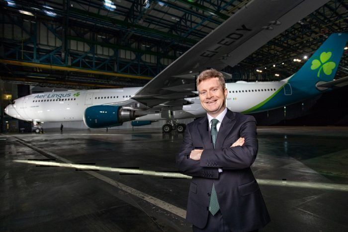 Aer Lingus boss with jet in background