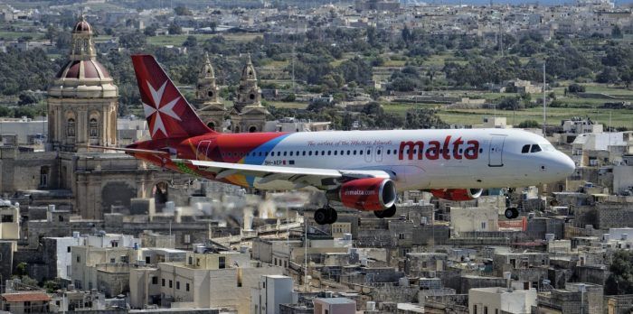 Air Malta Aircraft Over City