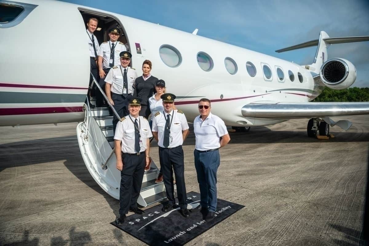 The One More Orbit team in front of the G650ER