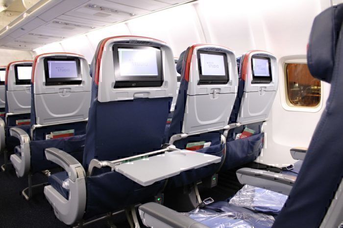 Inside the Comfort Plus cabin of a Delta Air Lines aircraft.