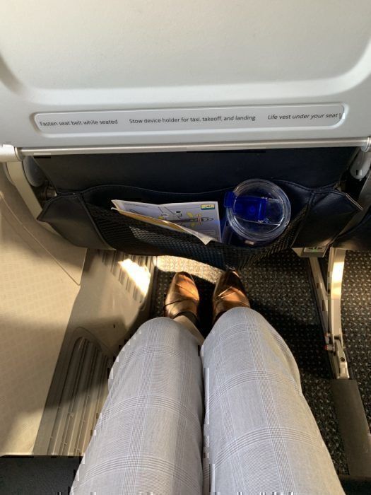 A photo showing the legroom of American Airlines Main Cabin extra seat.