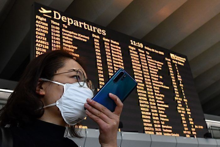 Passenger wearing masks near deaprtures boarding in Rome Airport