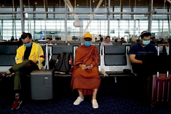 Passengers waiting to board at Hong Kong airport