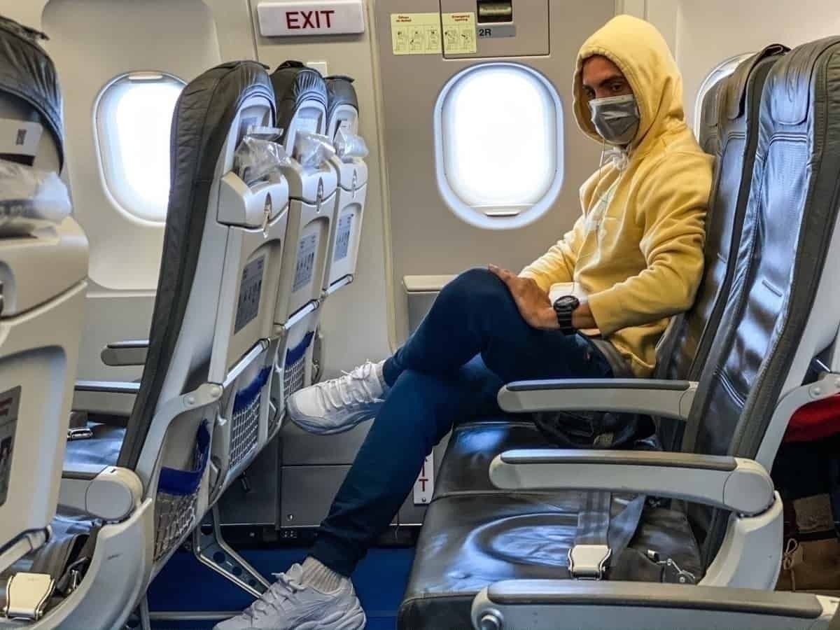 Passenger sits alone with face mask
