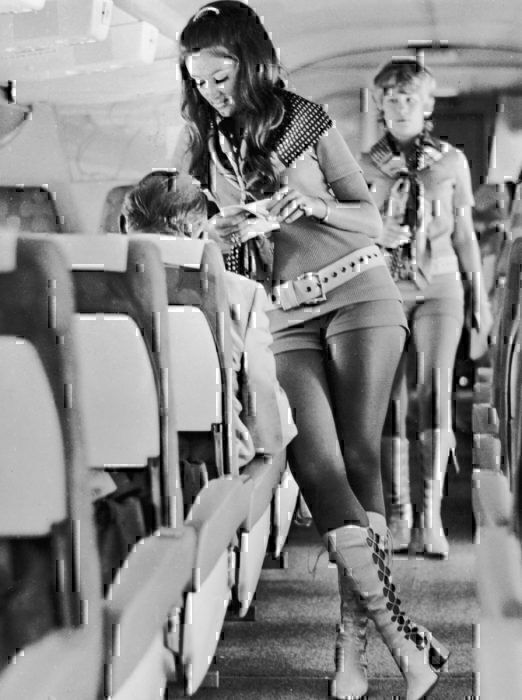 Women cabin crew in short clothing uniform