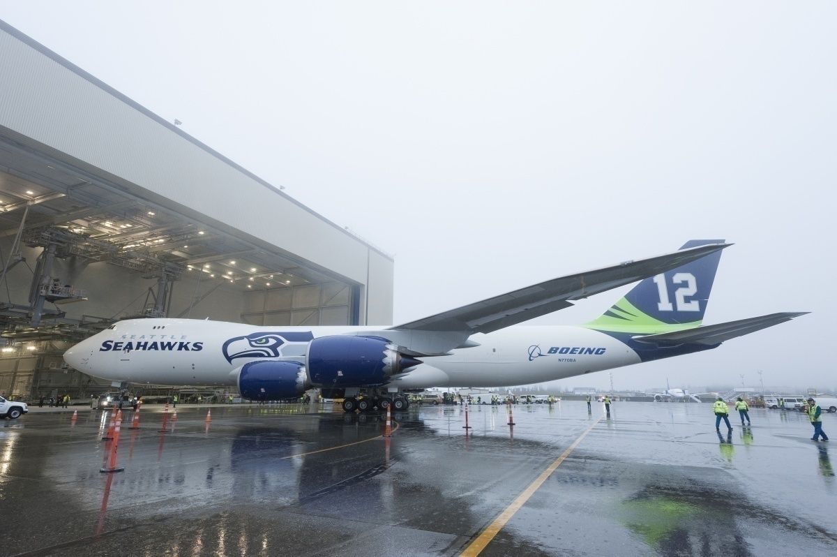 The Seattle Seahawks Boeing 747 being moved out of a hangar.