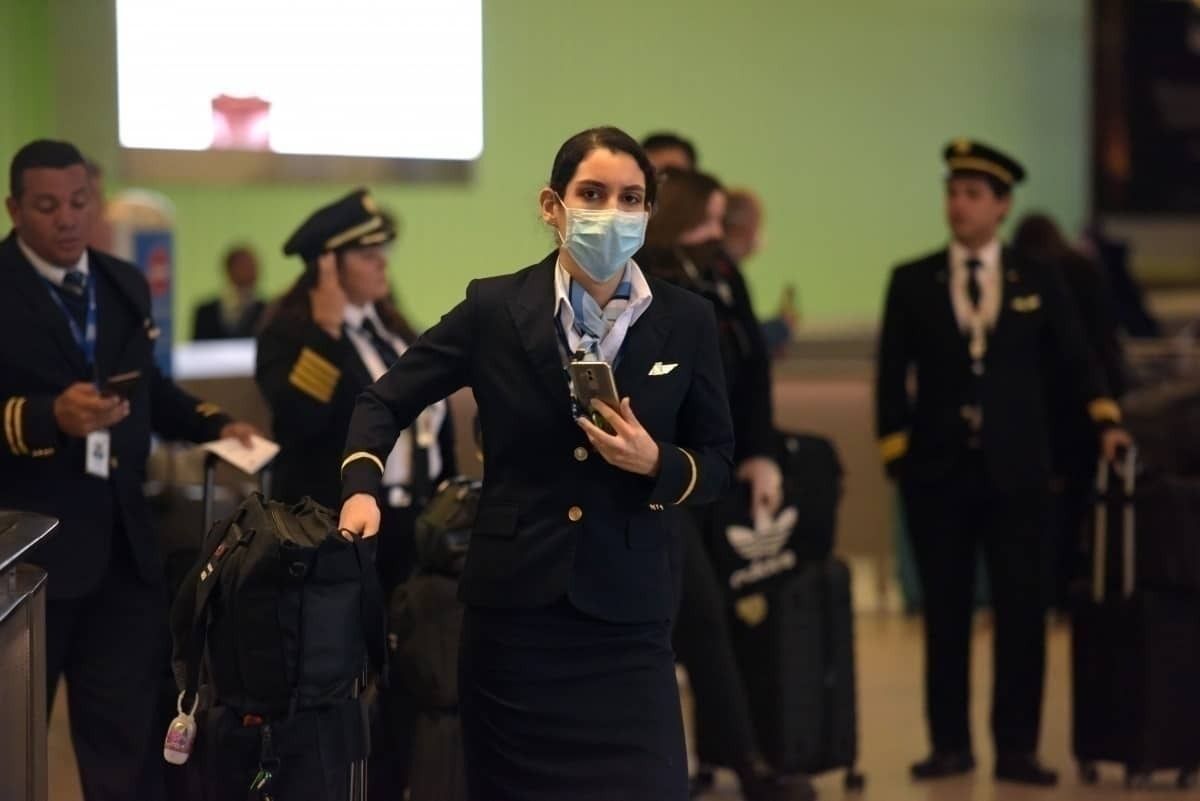 Flight attendants and pilots in masks