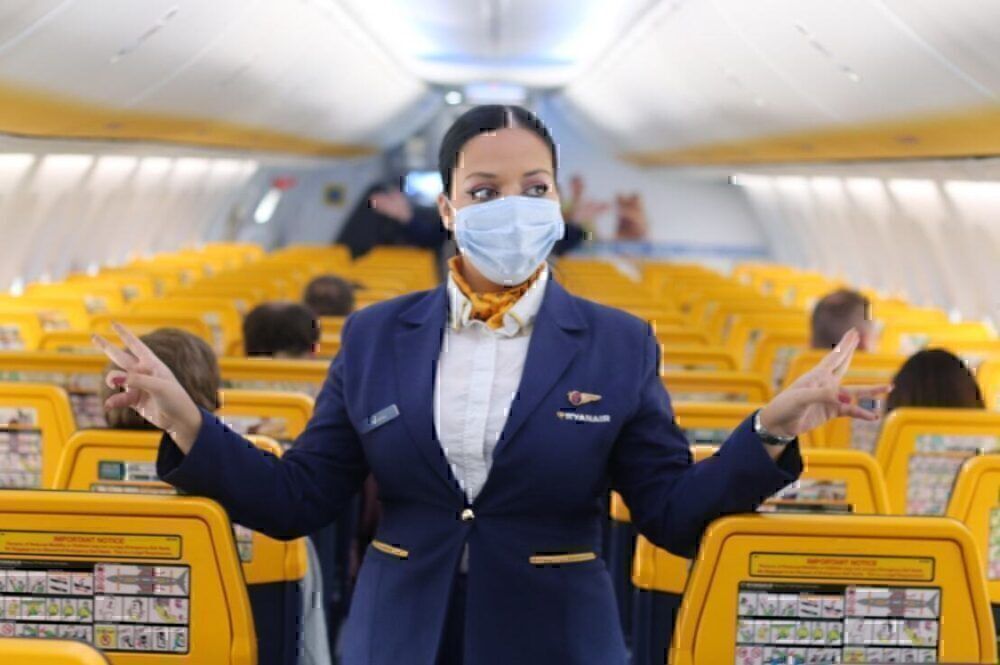 Cabin crew with face mask in ryanair cabin