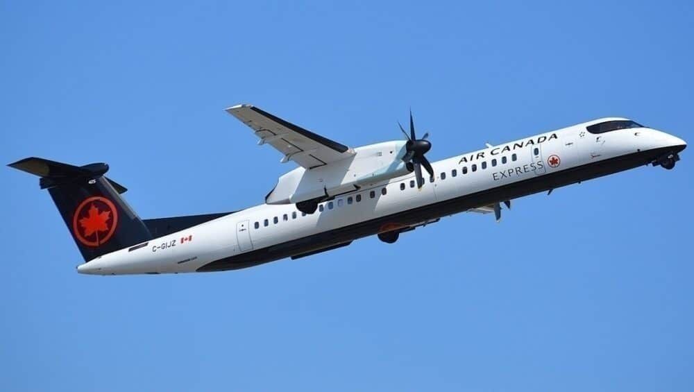 An Air Canada Dash 8-400 flying in the sky.