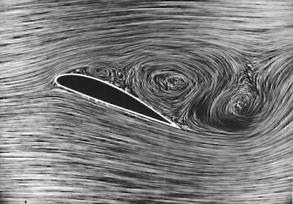 A black and white image showing the wind vortices around a wing.