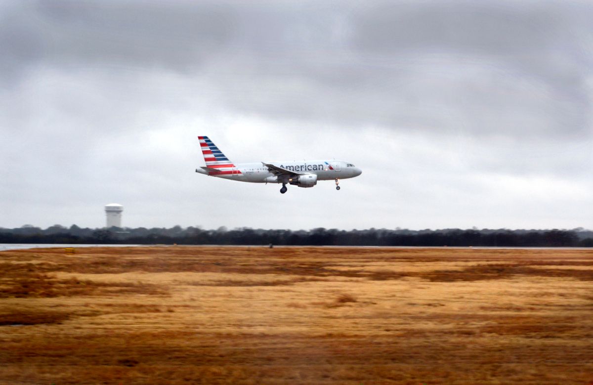 An American Airlines Airbus A319 passenger jet takes off on a rainy day from San Antonio International Airport in Texas