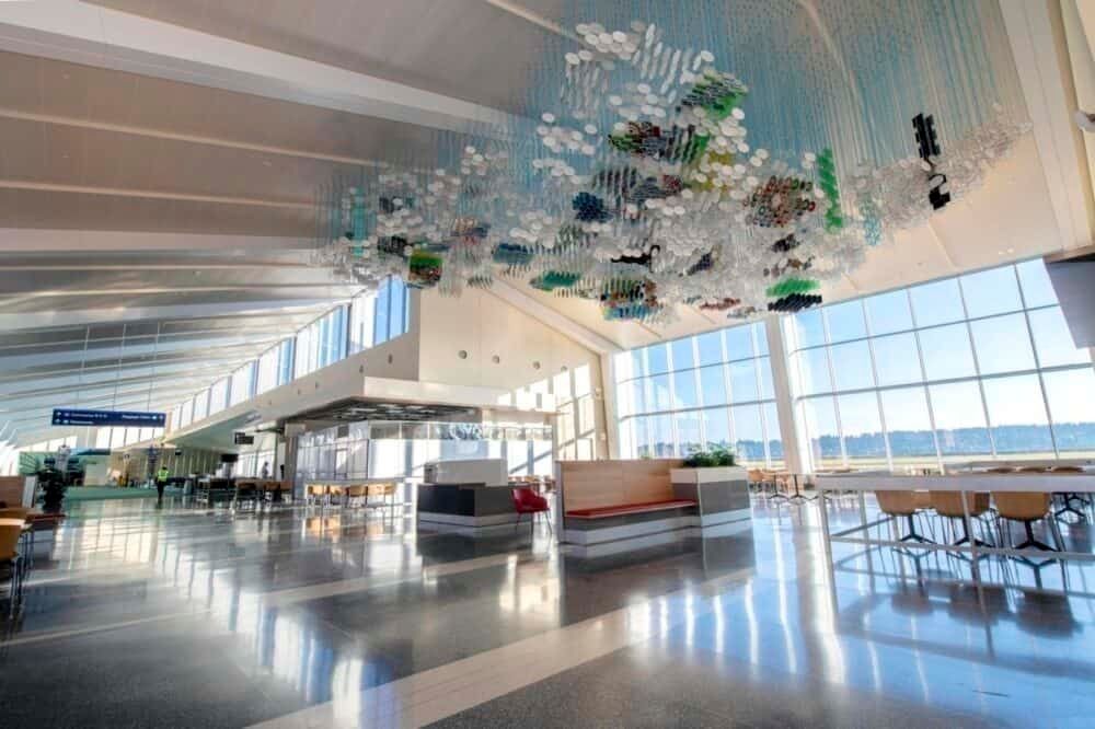 The concourse extension's generous use of glass allows for plenty of natural light. Two three-dimensional sculptures hang at the center of the concourse. 
