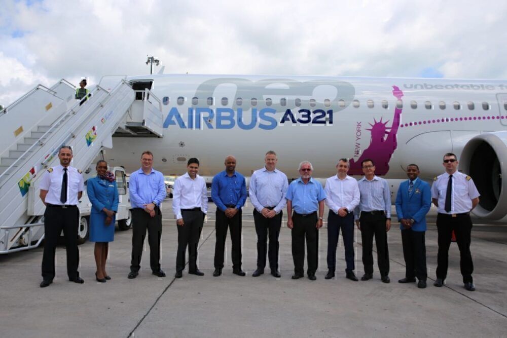 Crew beside A321LR which flew from Mahe to Toulouse