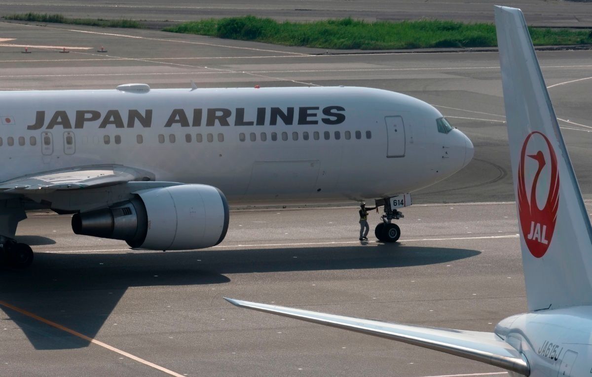 Japan Airlines plane runway gender neutral non-binary Getty Images
