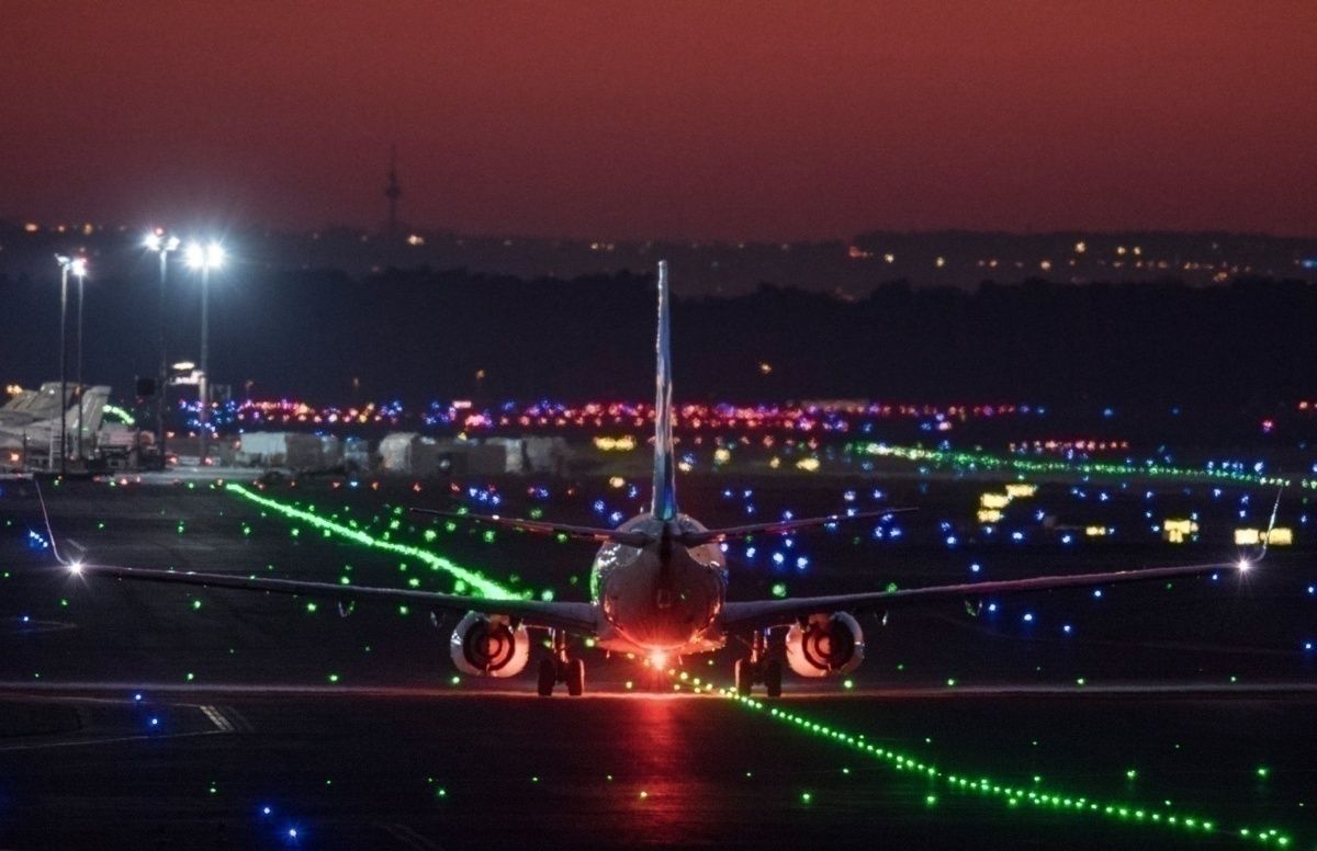 plane landing night time getty images