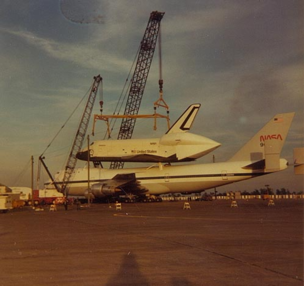 The space shuttle Enterprise being lifted onto one of NASA's 747s.