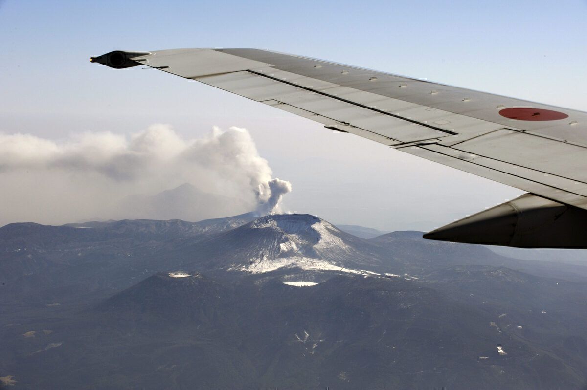 Plane Passing Volcano