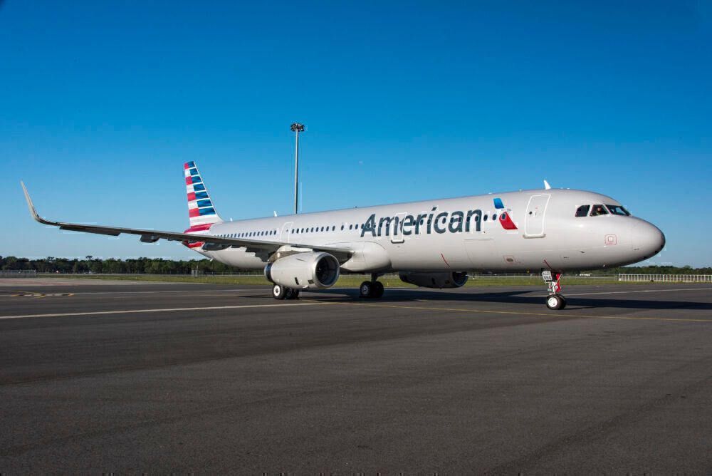 An American Airlines Airbus A321 Transcontinental on an airport apron.