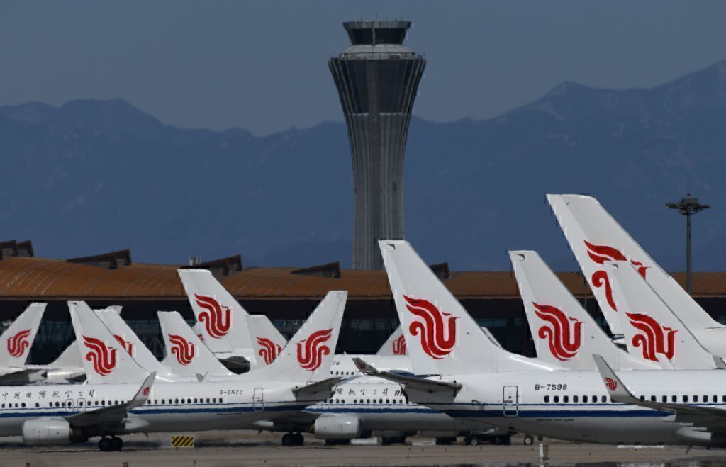 Air China planes are seen parked on the tarmac at Beijing Capital Airport on March 27, 2020
