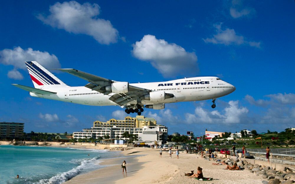 Air France Boeing 747-200M on very low final-approach over Maho Beach with hotels behind