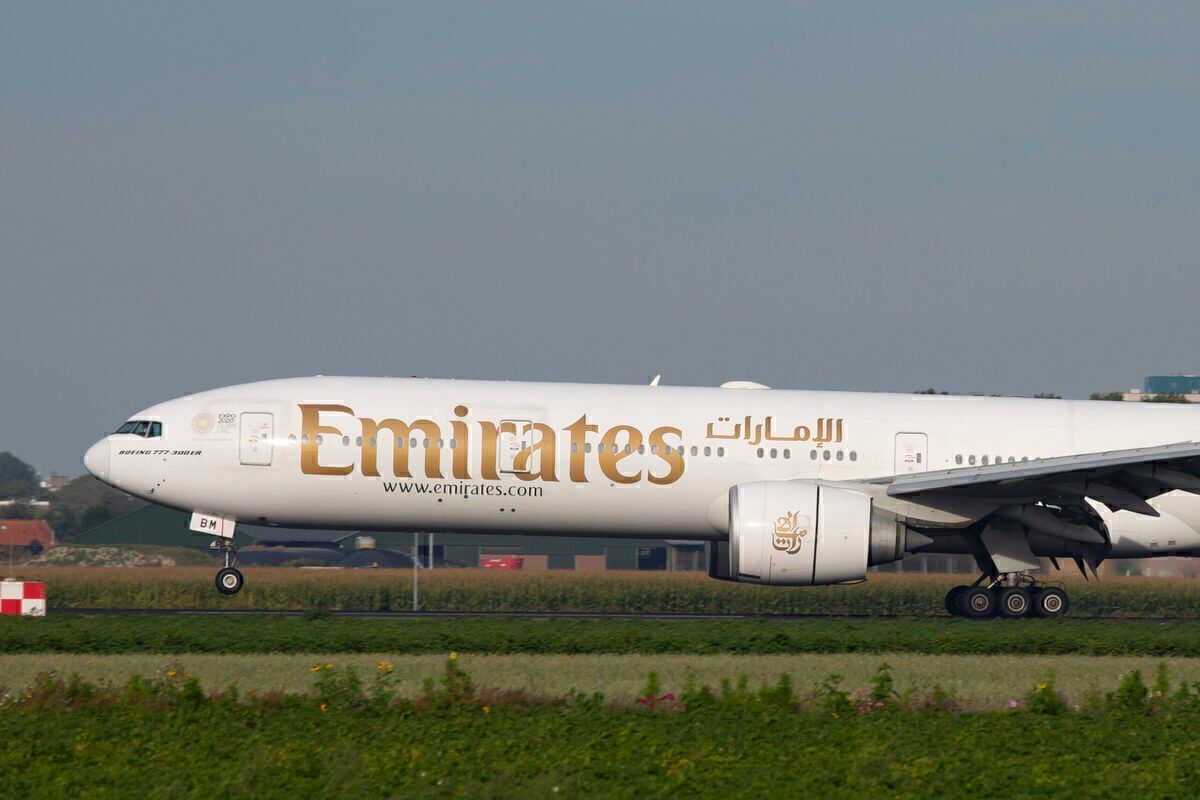Emirates, Boeing 777-300ER commercial airplane lands at
