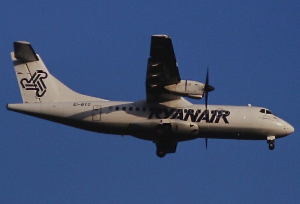 A Ryanair ATR 42 flying in the sky.