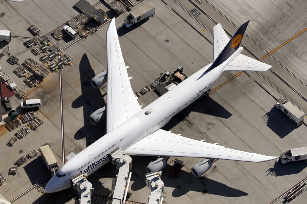 A Lufthansa Boeing 747-800 is seen parked at the stand in
