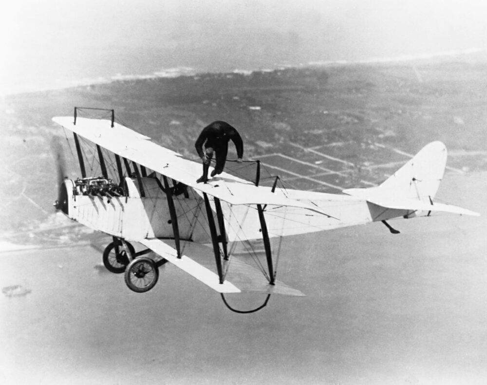 Stuntman Walking on Wing of Curtiss JN-4D Jenny Biplane