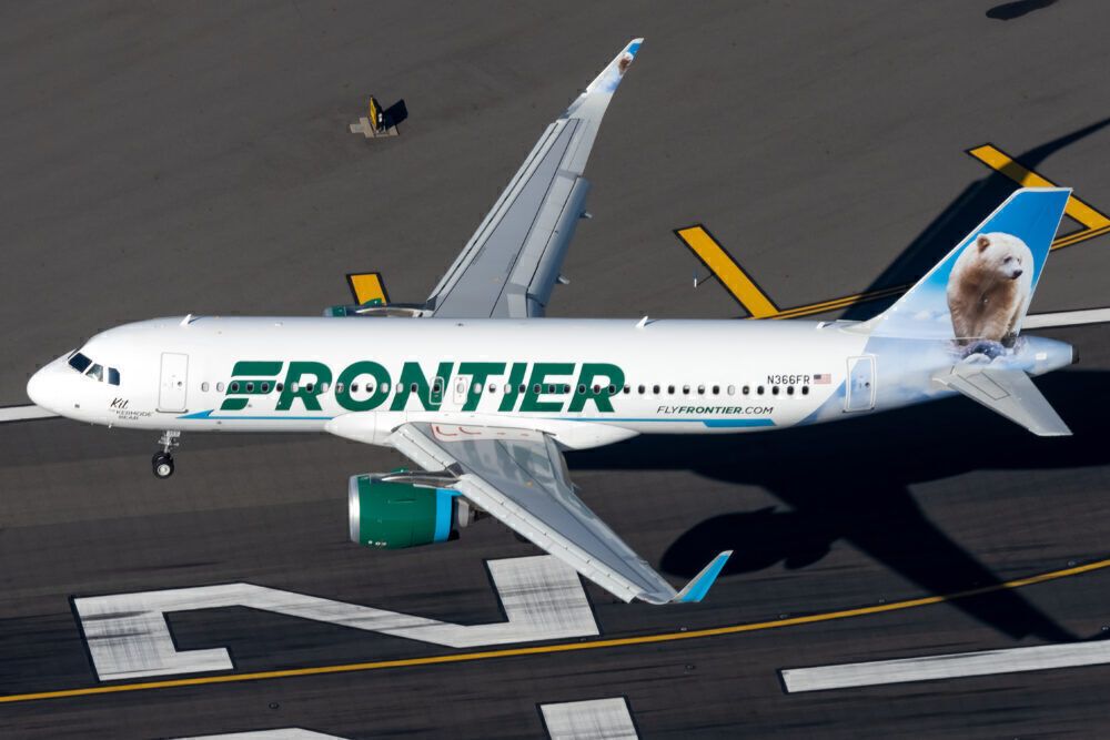 A Frontier Airlines aircraft just after taking off.