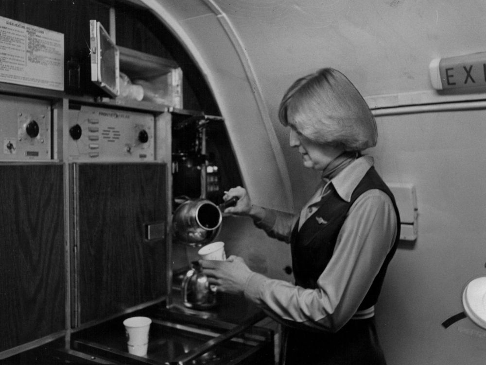 JAN 15 1979, JAN 23 1979, JAN 28 1979; Frontier Airlines attendant samples coffee before taking off
