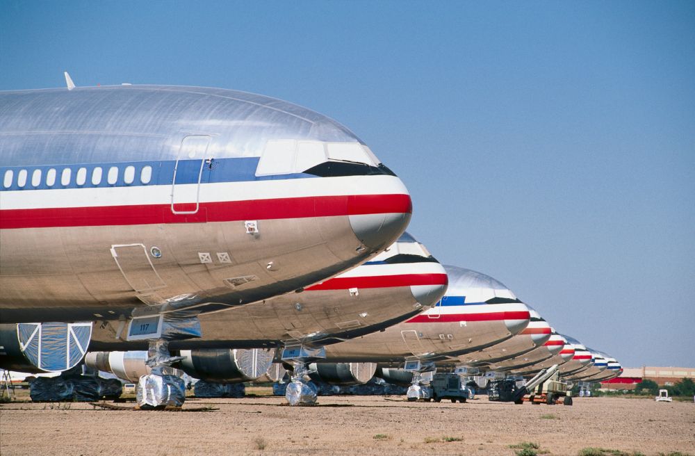 a row of noses of American Airlines McDonnell Douglas DC-10s parked after retirement in to desert-storage
