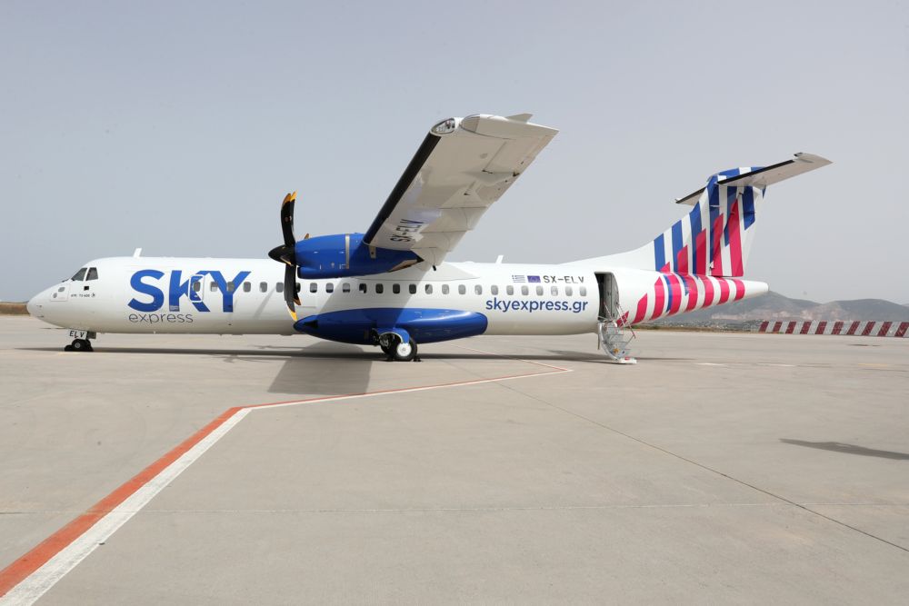A Sky EXpress ATR 72-600 parked at an airport.