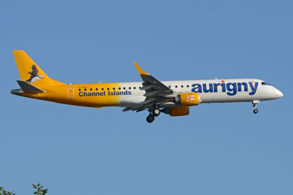 Aurigny Air's Embraer E190 flying in the sky.