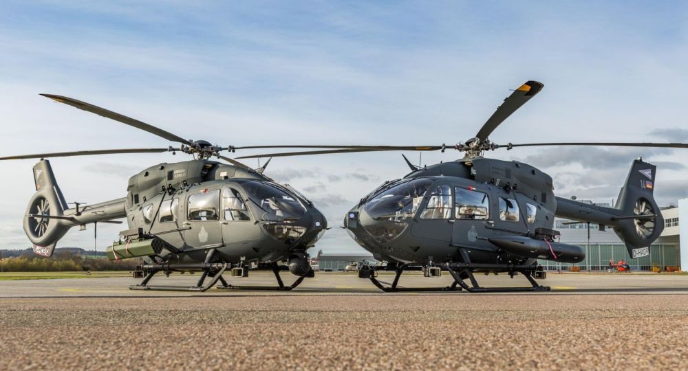 Two Hungarian Air Force Airbus H145M helicopters parked side by side.