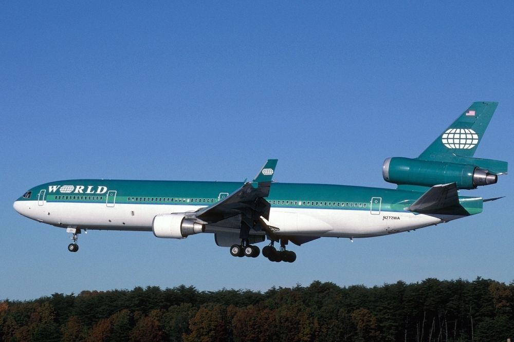 An Aer Lingus World Airways MD-11 on final approach.