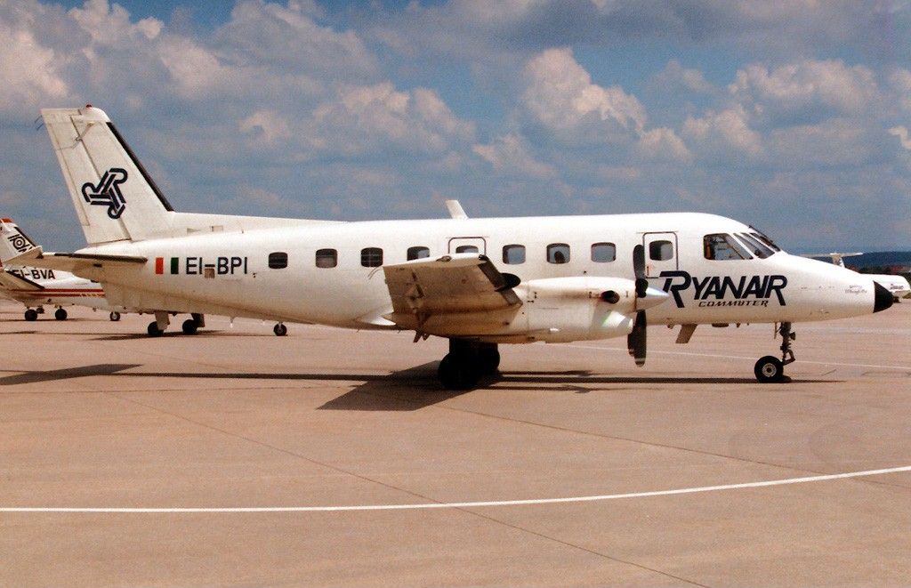 A Ryanair EMB-110 parked at an airport.