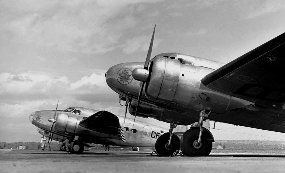 Lockheed 10-A and 14H-2 in Lineup at Airport