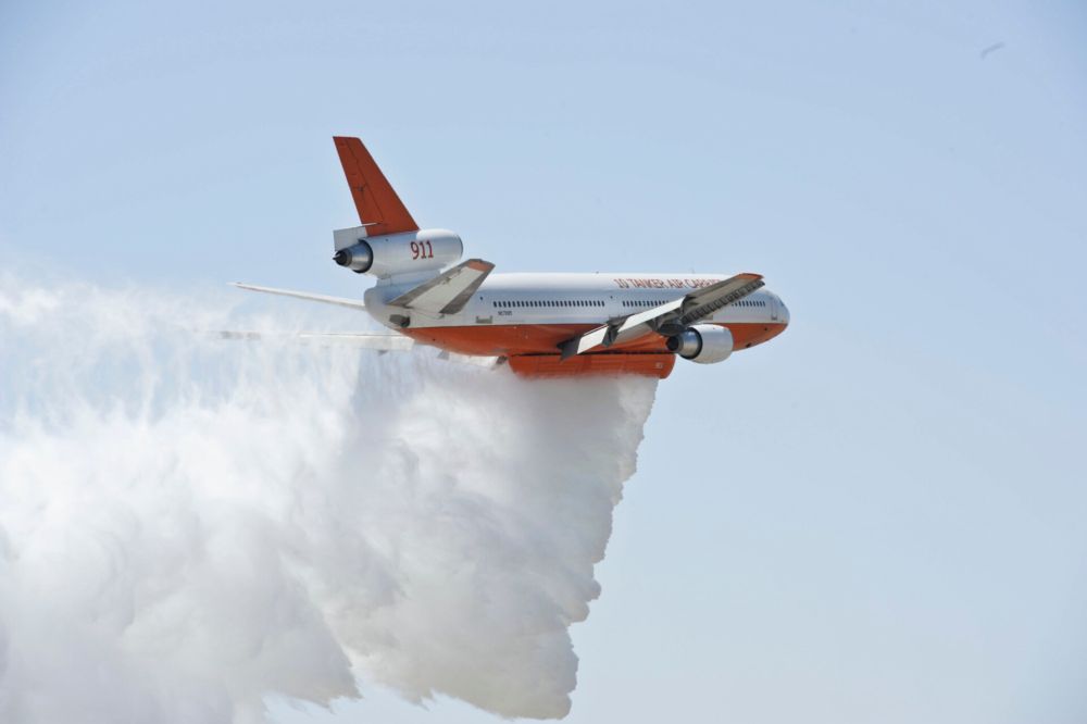 A DC-10 Tanker dropping water from the sky.