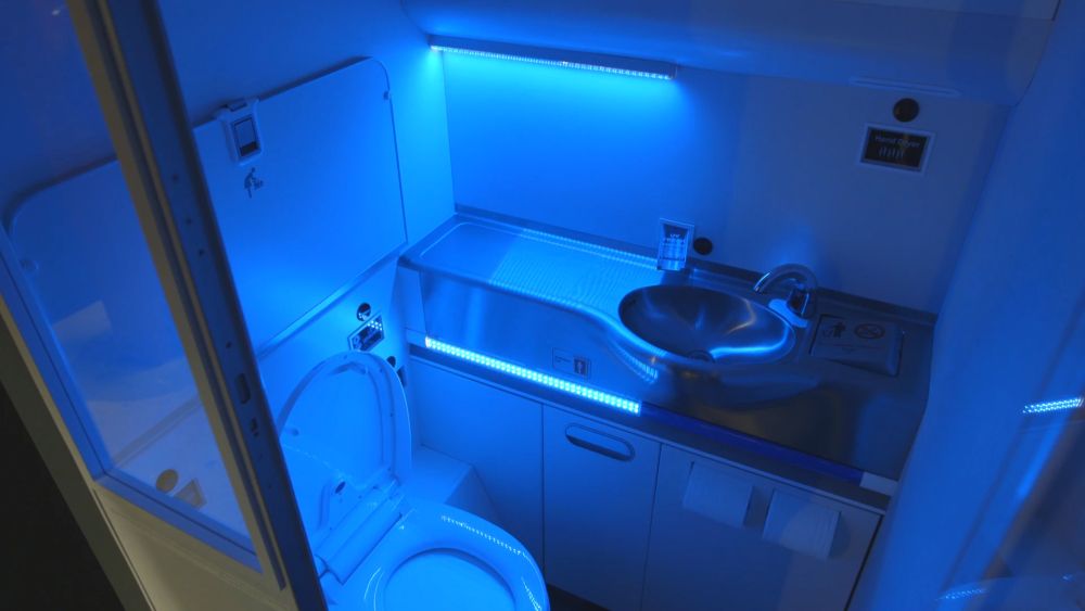 A standard size aircraft lavatory with UV lighitng to clean itself after use.