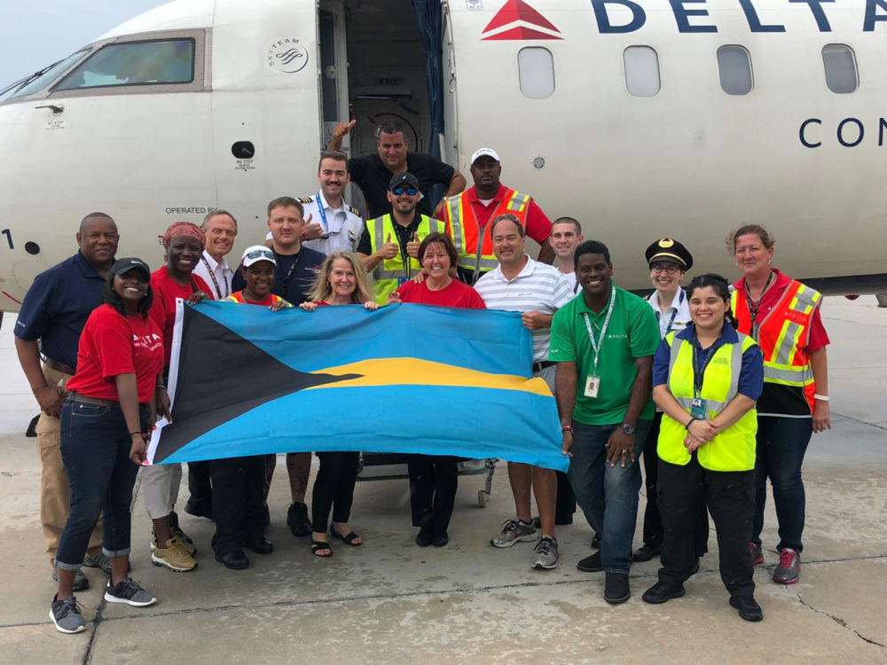 /wordpress/wp-content/uploads/2022/01/Bahamas-relief-flight-photo-with-flag-1000x750.png