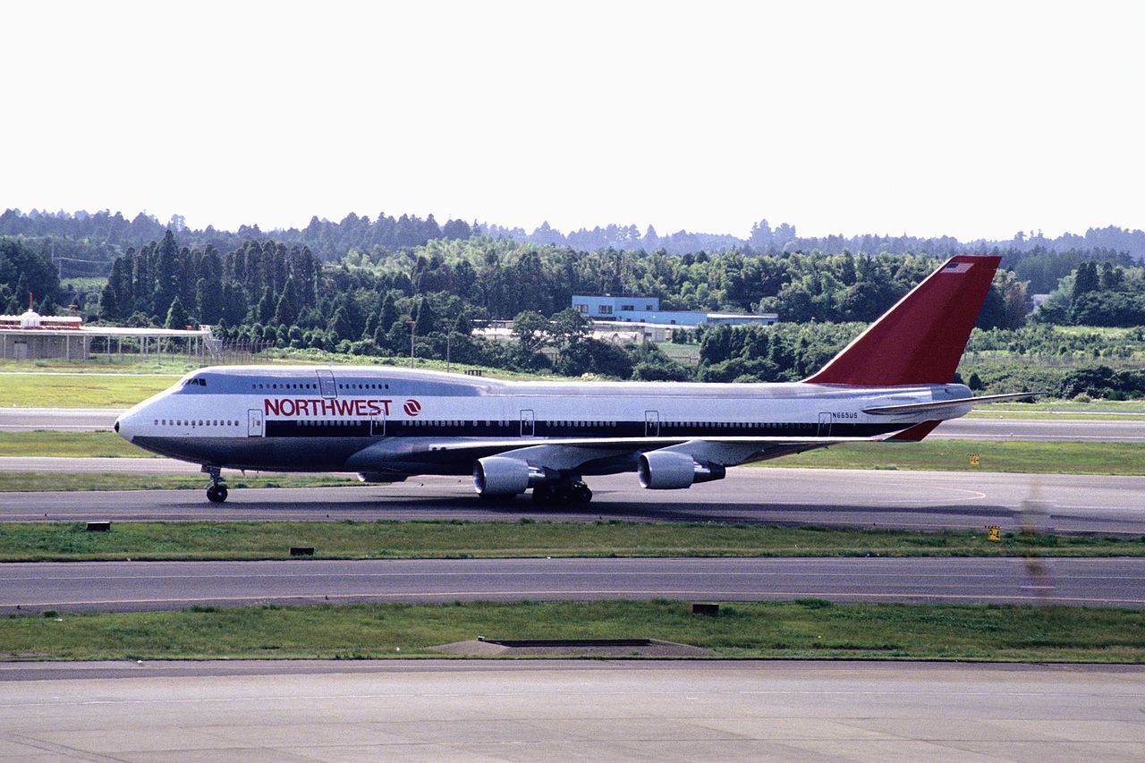 A Northwest Airlines Boeing 747 on an airport apron.