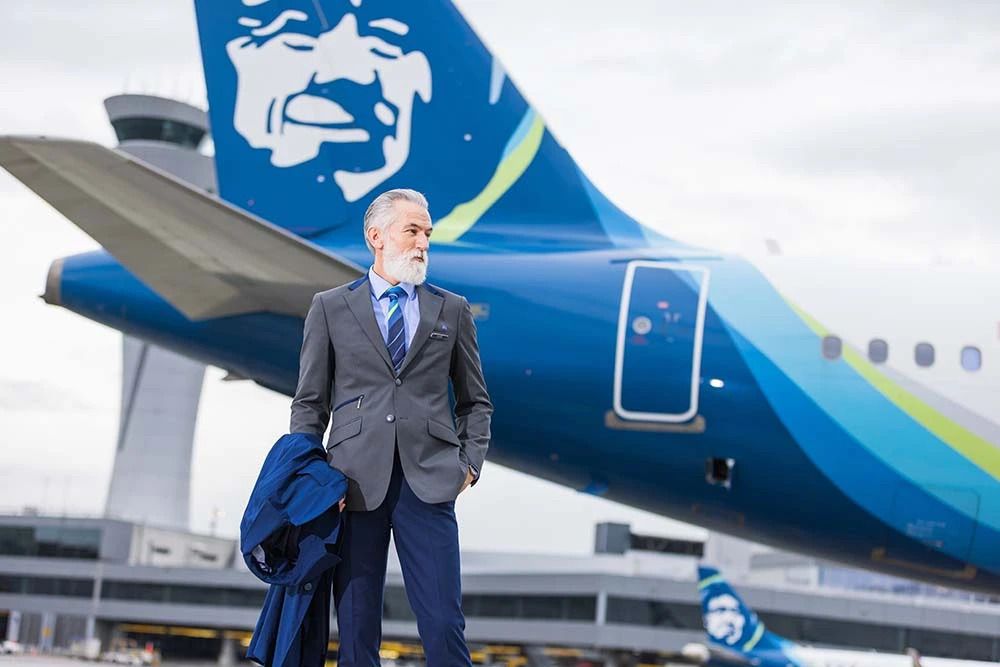David Posing In Front of an Alaska Airlines Airbus at SFO in Alaska Airlines Uniform
