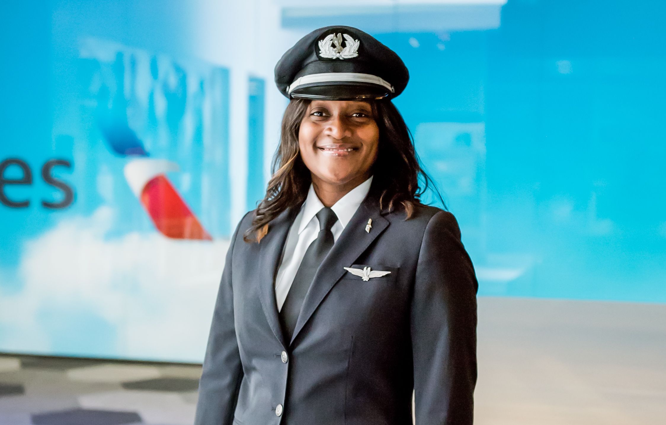 Pilots-female-with-American-Airlines-logo-backdrop