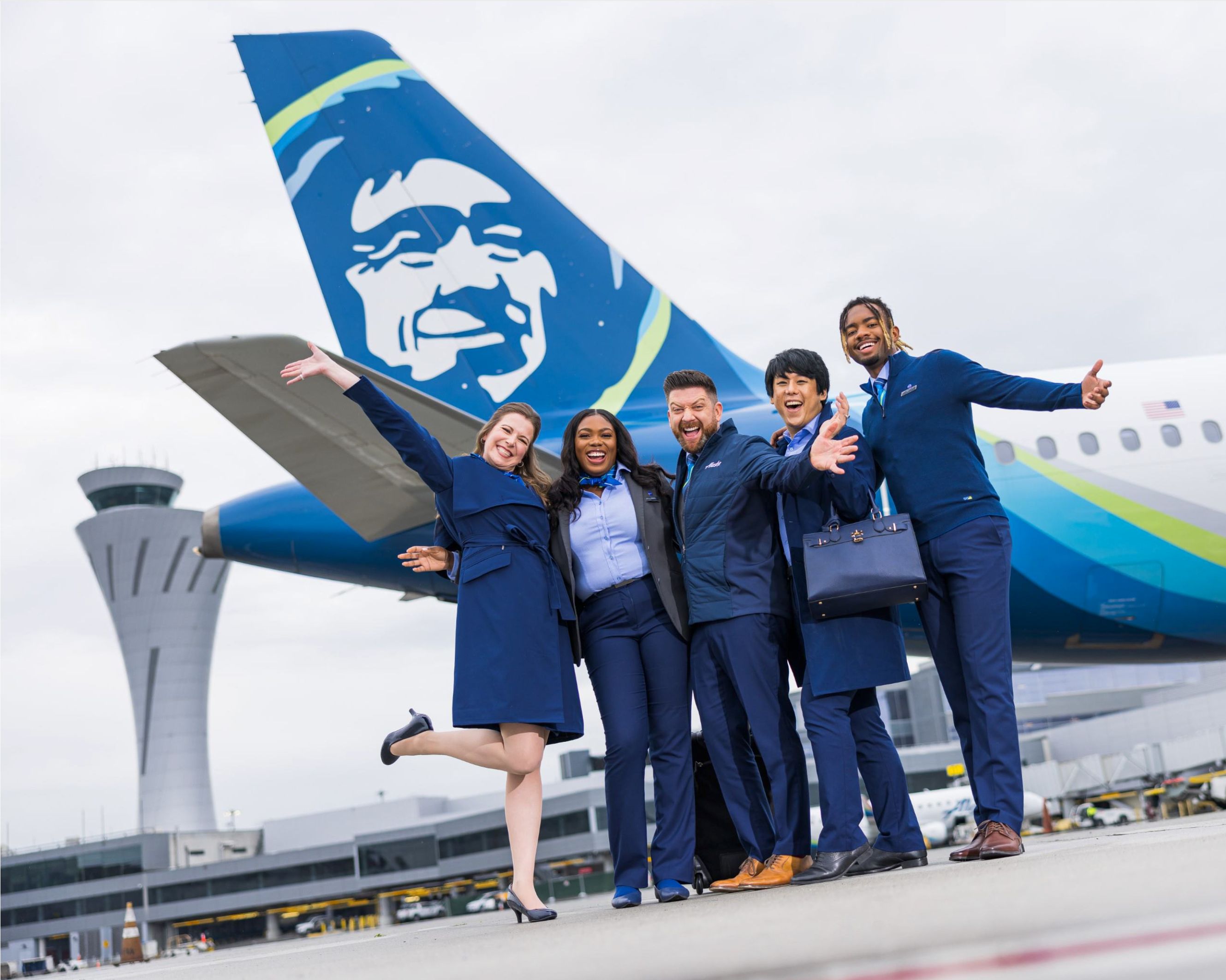 Alaska Airlines Employees of Multiple Genders Posing With A321 & Control Tower
